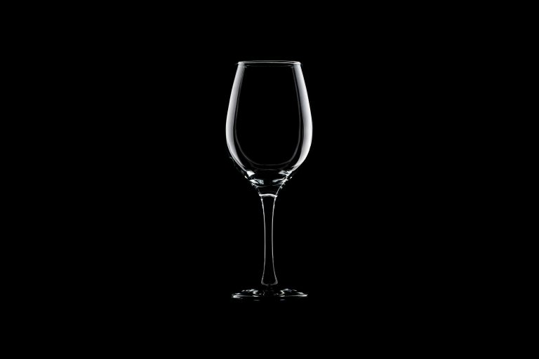 Minimalist image of an empty wine glass, symbolizing GLPs and reduced consumption, illustrating how lower appetite is reshaping food, hospitality, and lifestyle demand.