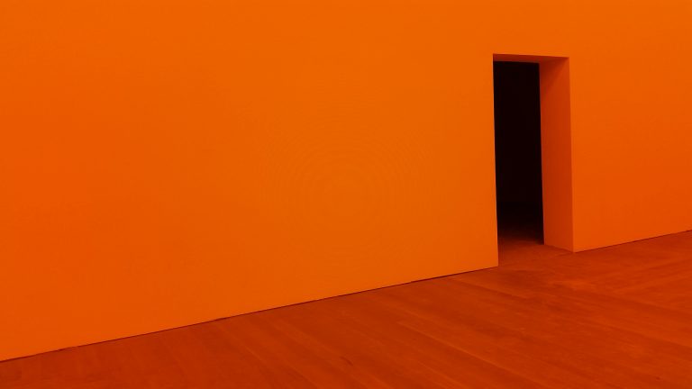 The vast expanse of orange wall before you get to the open door reinforces the distance between the customer relationship and your ability to act on it.