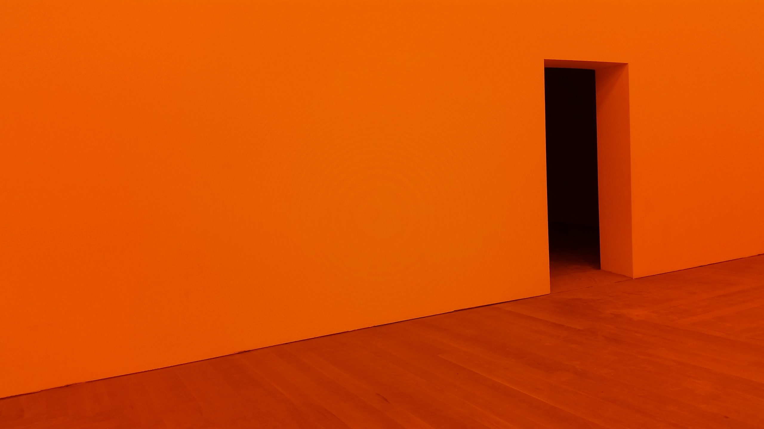 The vast expanse of orange wall before you get to the open door reinforces the distance between the customer relationship and your ability to act on it.